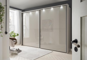 pebble grey matt carcass with pebble grey glass doors, external frame with lights, with slate handles