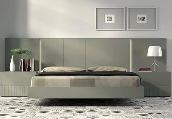 Guardia IRIS floating bed illustrated in Green matt lacquer, shown with matching wall panel extensions and bedside tables.