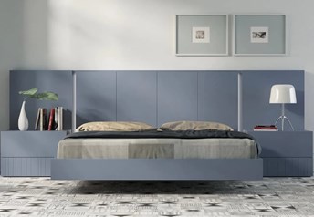 Guardia IRIS floating bed in Cobalt matt lacquer, shown with matching wall panel extensions and bedside tables.