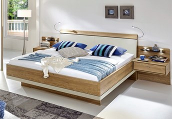 Version with synthetic leather headboard in champagne, bedframe perimeter trim in champagne matt