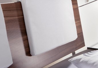 walnut headboard with Varo pads white