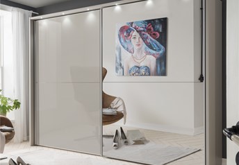The wardrobe featured is Pebblegrey matt carcass with one door in mirror and one in Pebblegrey glass, with passe partout frame with lights