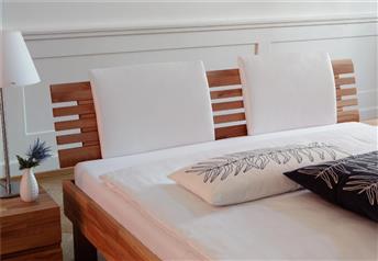 Litto headboard in cherry beech with Suny real leather white pads